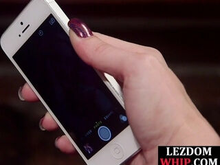 Lezdom MILF whips redhead sub before fucks her with strapon