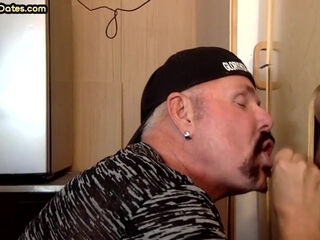 Gloryhole gaydaddy sucks and wanks dick through hole