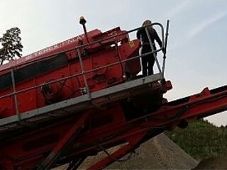 Granny is walking around in a gravel pit wearing sheer leggings!